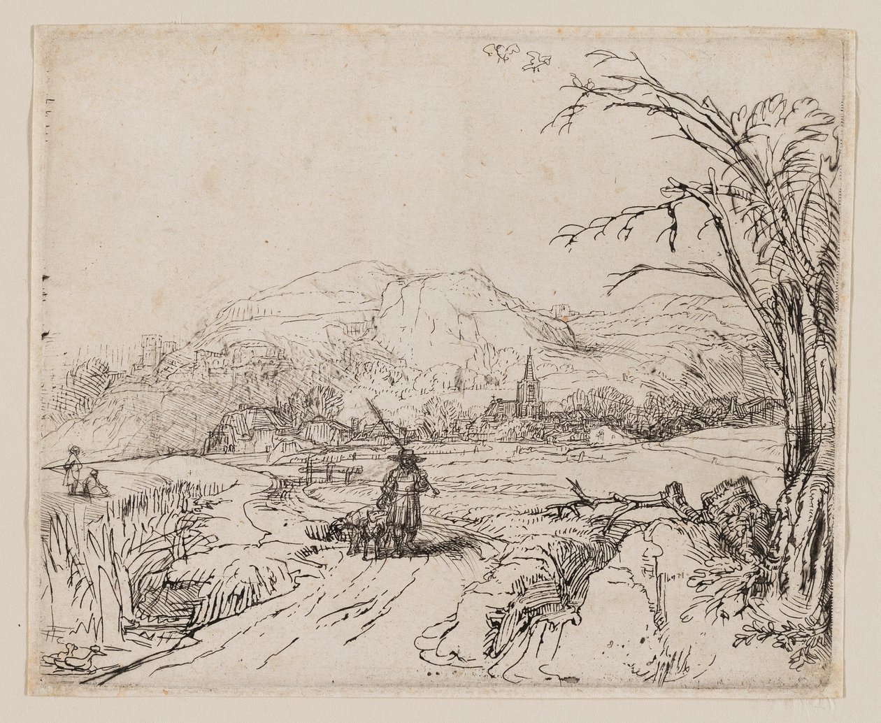 Landskap med idrottsman och hundar av Rembrandt van Rijn