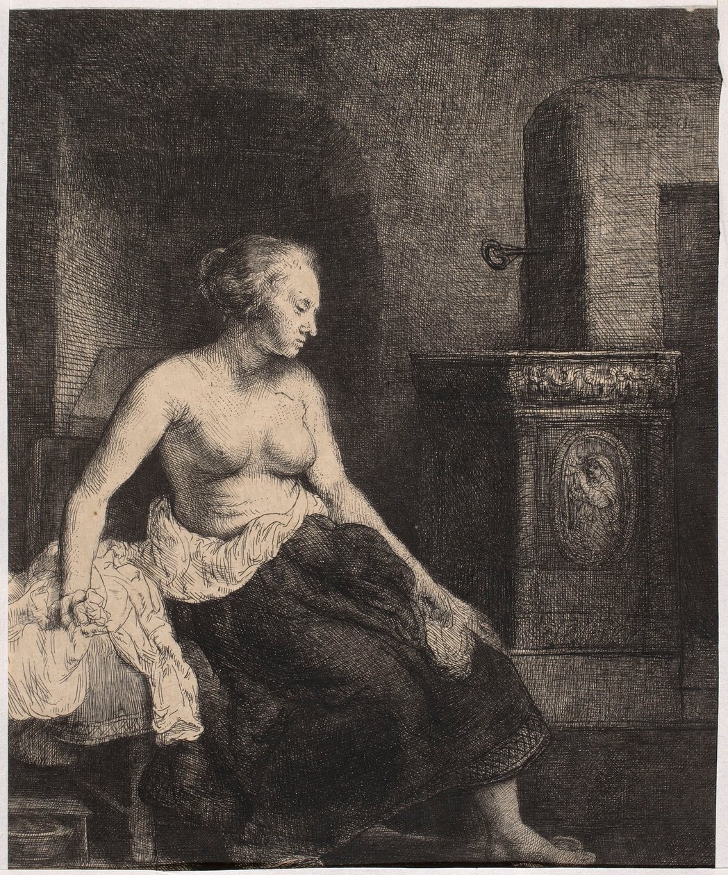 En halvnaken kvinna som sitter vid kaminen av Rembrandt van Rijn