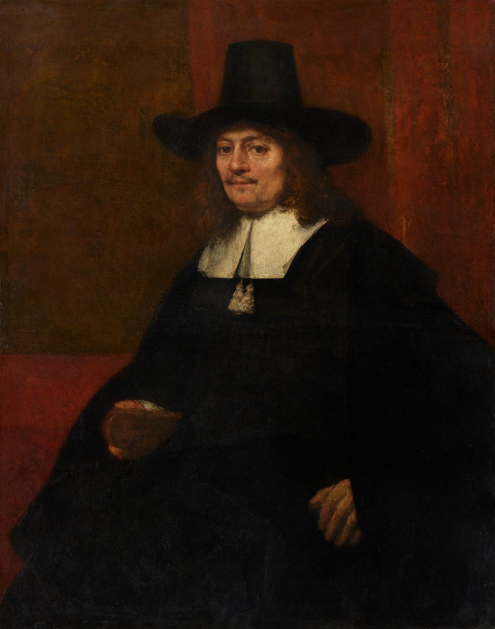 Porträtt av en man i en hög hatt av Rembrandt van Rijn