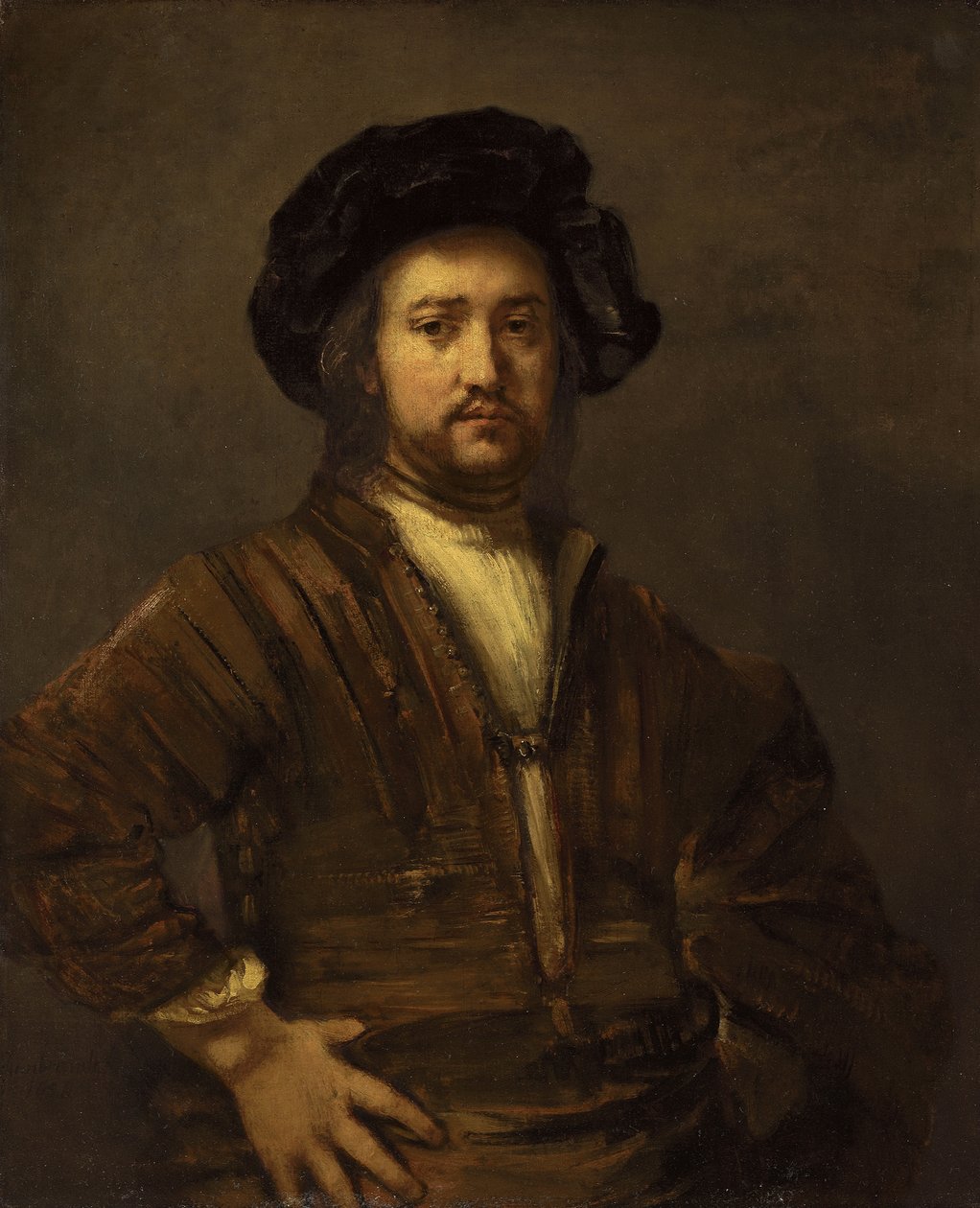 Porträtt av en man med armar akimbo av Rembrandt van Rijn