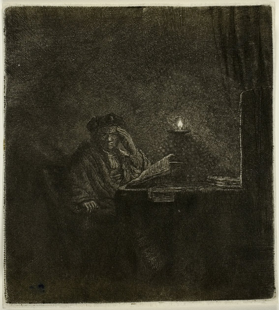 Student vid ett bord vid levande ljus av Rembrandt van Rijn