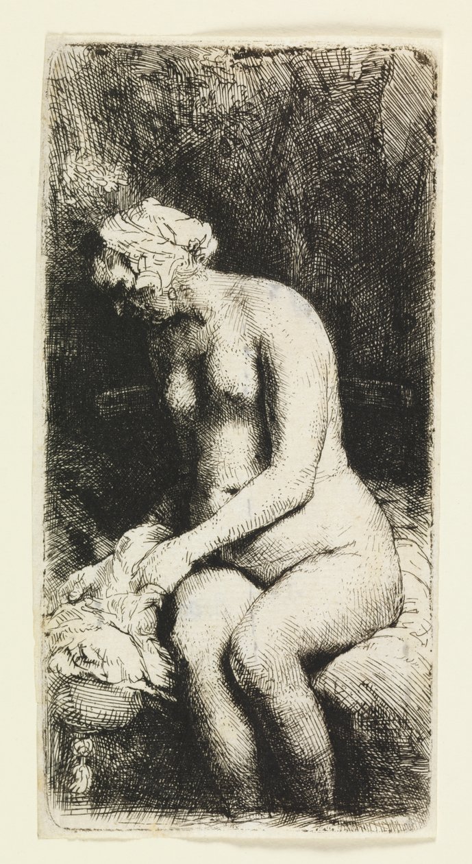Kvinna som badar sina fötter vid en bäck av Rembrandt van Rijn