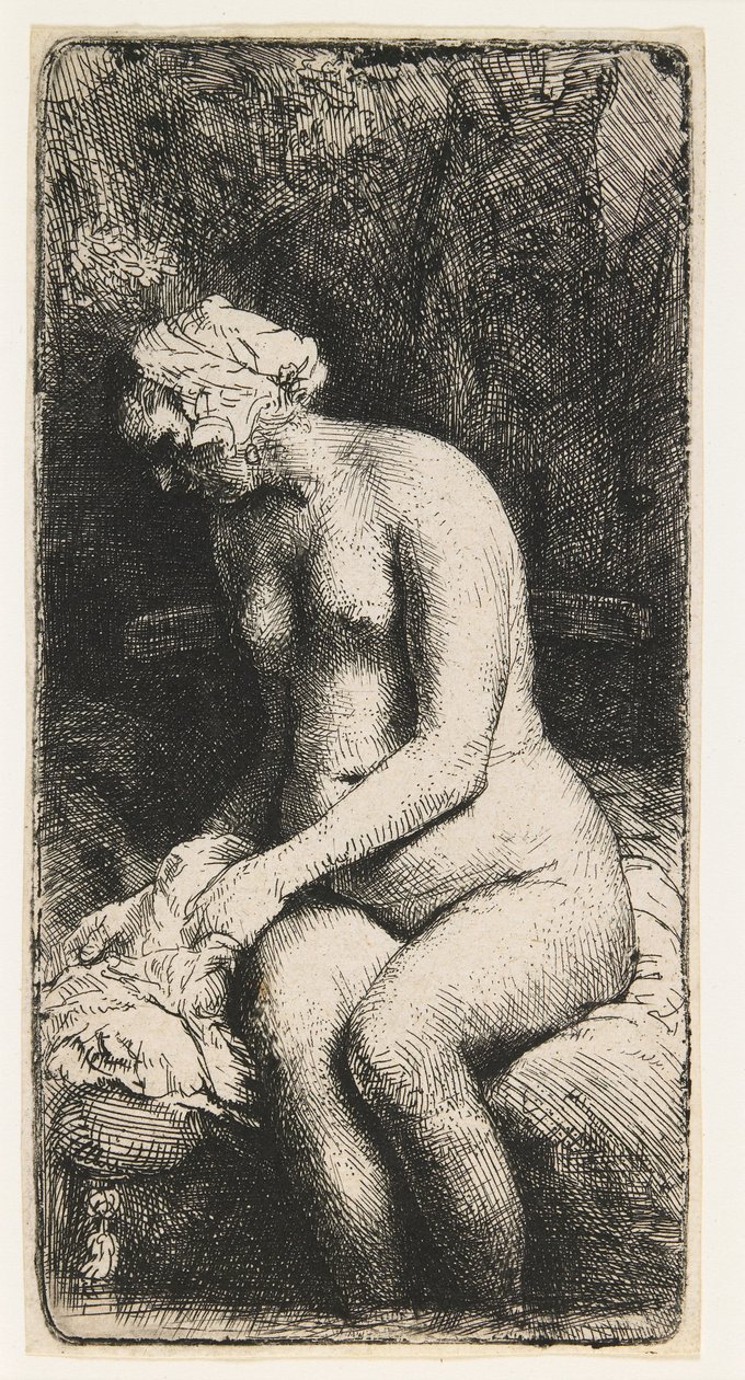 Kvinna som badar sina fötter vid en bäck av Rembrandt van Rijn