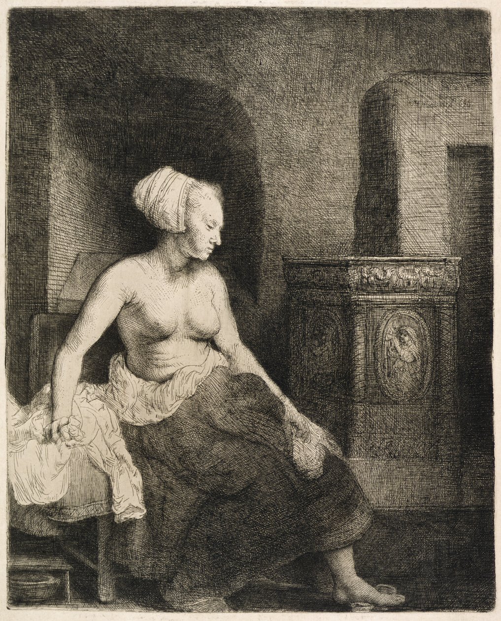 Kvinna som sitter halvklädd bredvid en spis, 1658 av Rembrandt van Rijn