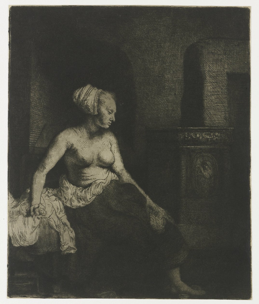 Kvinna som sitter halvklädd bredvid en spis Kvinna som sitter halvklädd bredvid en spis av Rembrandt van Rijn