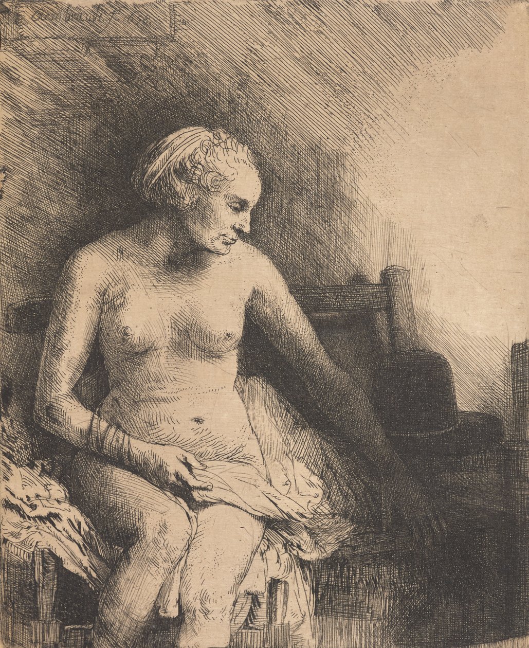 Kvinna vid badkaret med en hatt bredvid sig av Rembrandt van Rijn