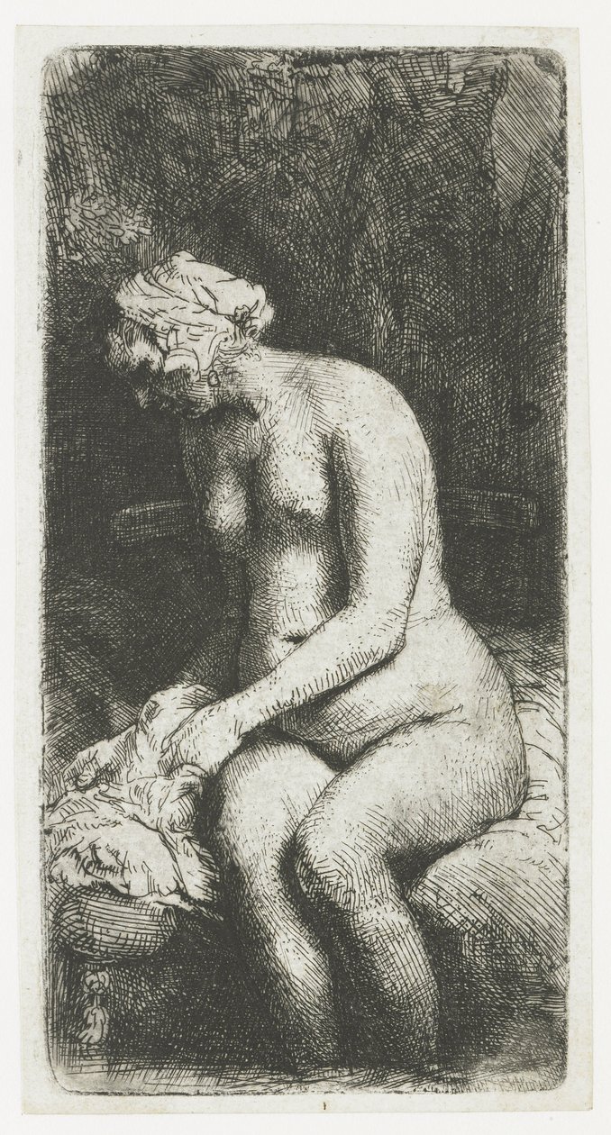 Kvinna som badar fötterna vid en bäck av Rembrandt van Rijn