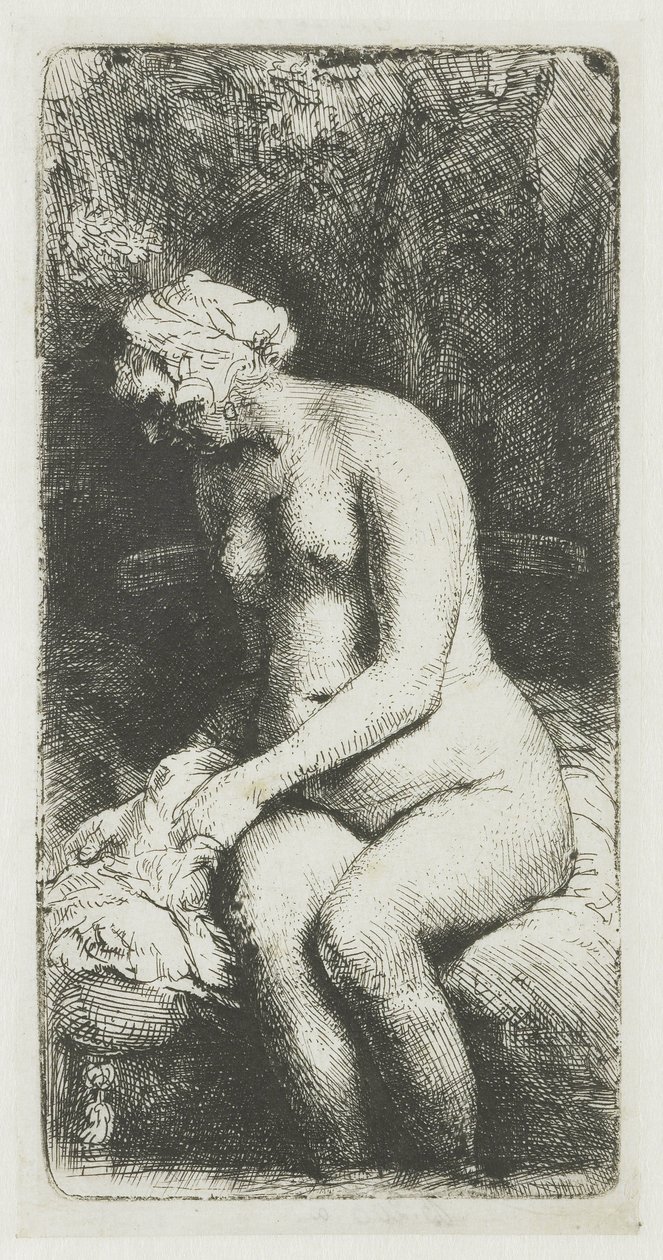 Kvinna som badar fötterna vid en bäck av Rembrandt van Rijn