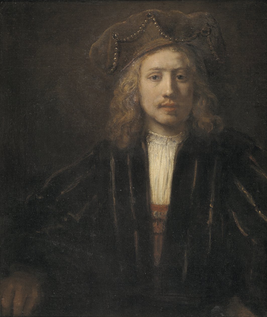 Ung man i en pärlklippt keps av Rembrandt van Rijn