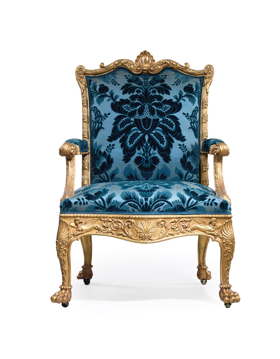 En av ett par George III fåtöljer i förgyllt trä av Robert Adam