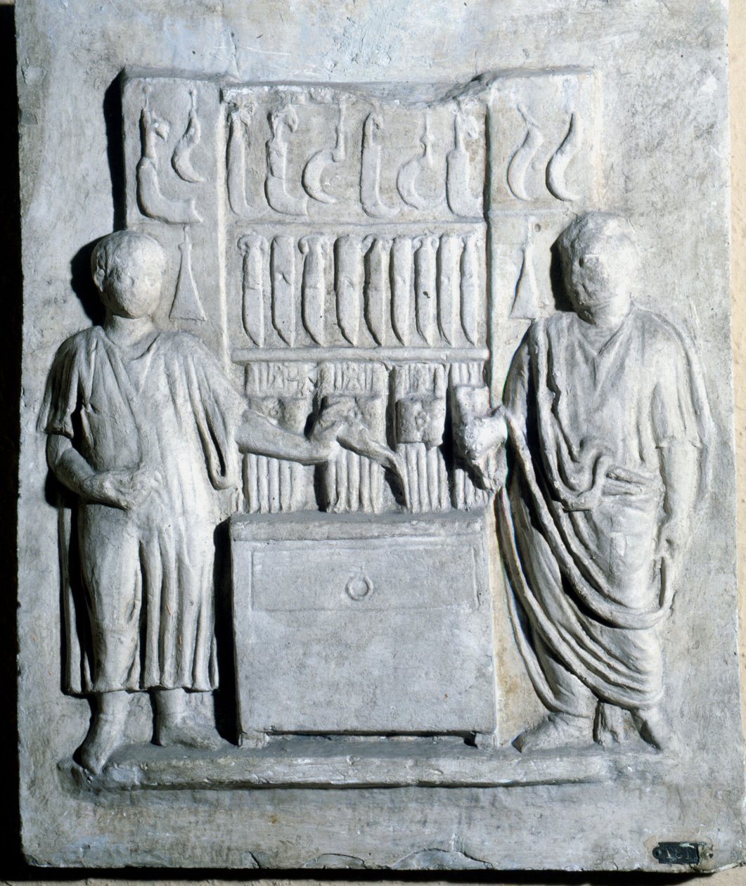Tecken på knivaffären under romartiden. Museo di Ostia (Ostia) av Roman Roman