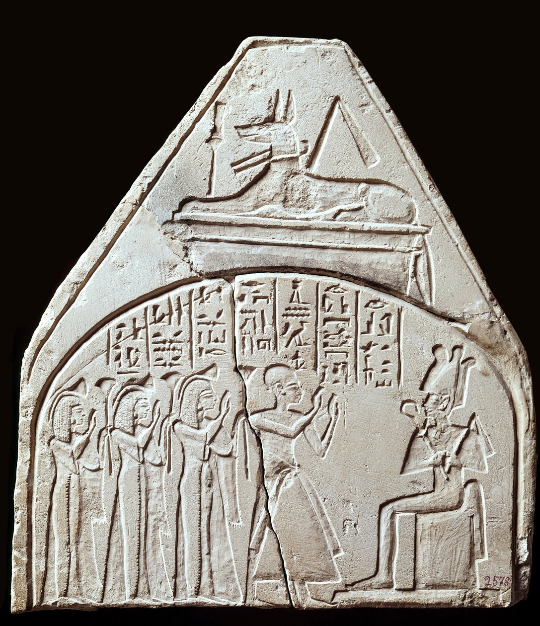 Egyptisk antikvitet: stelfragment som representerar dyrkan av guden Osiris. Ovan föreställer det Anubis. Paris, Louvren av School Egyptian