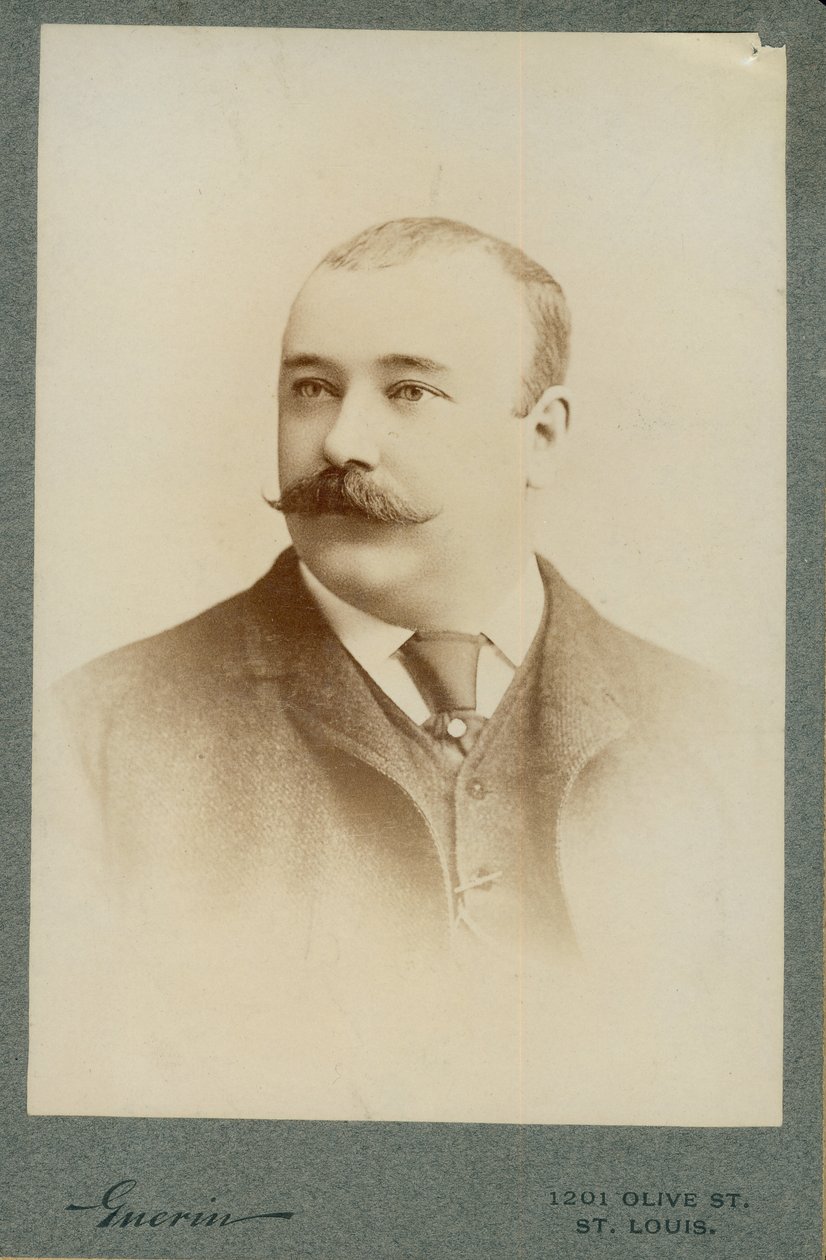 Bust portrait of Clarence F. Newcomb wearing a suit, vest, and tie, with his head turned to the left. av St. Louis F.W. Guerin