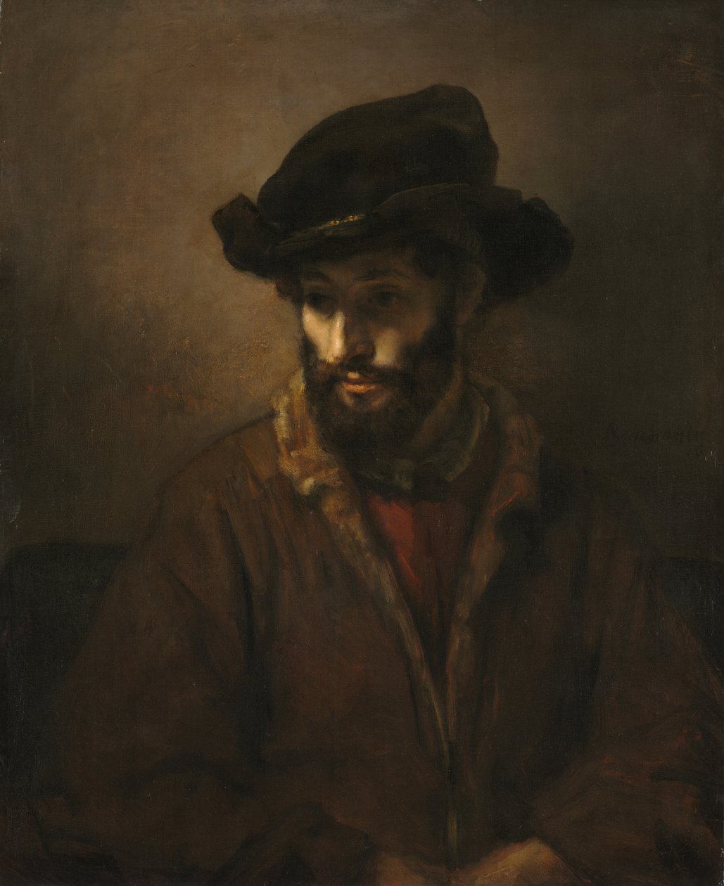 En skäggig man som bär en hatt av Studio of Rembrandt van Rijn