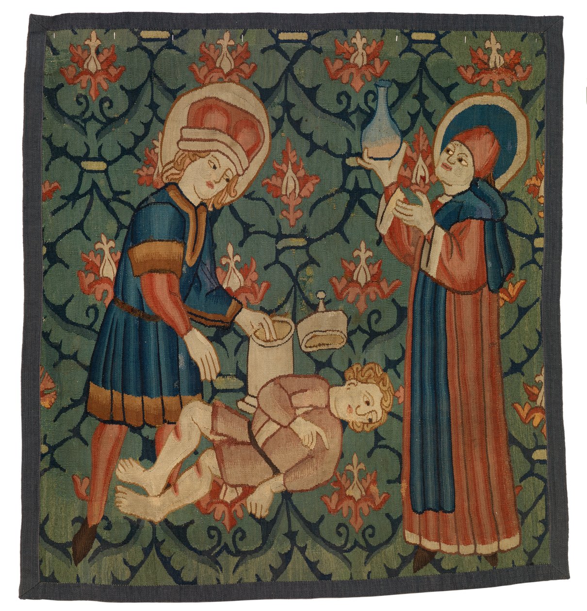 Gobelängfragment föreställande St Cosmas och St Damian av Swiss School