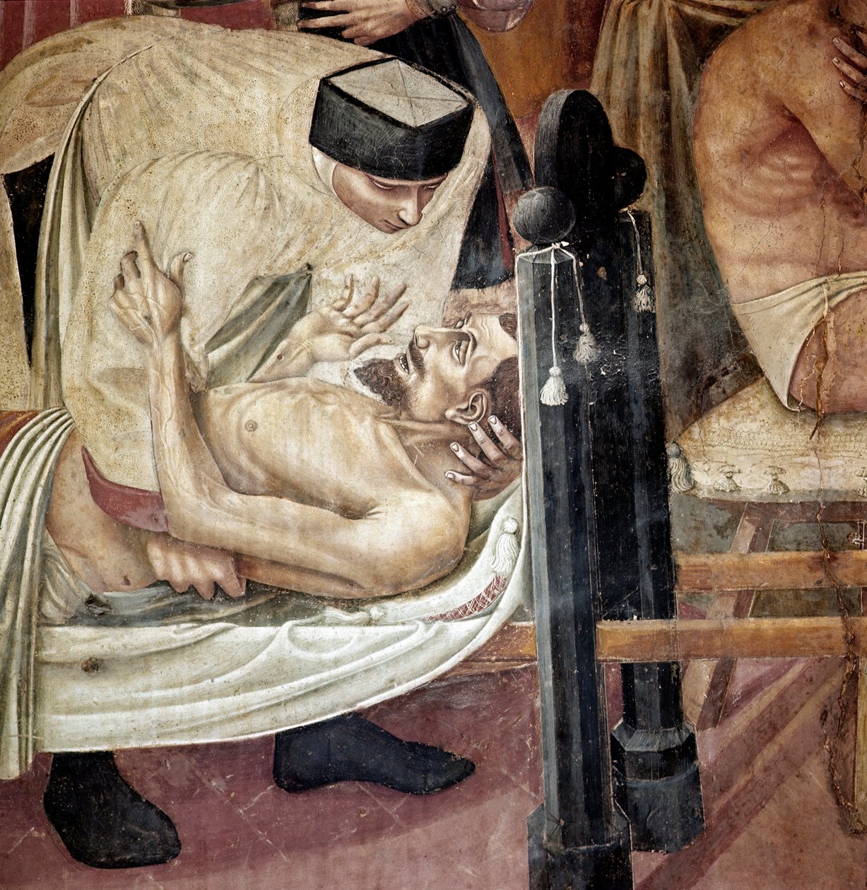 Vård av sjuka på sjukhus, en sjuksköterska hjälper en skadad liggande på en bår”” Detalj. Fresk av Taddeo di Bartolo (1363-1422) Siena från 1300-talet, Spedale di Santa Maria della Scala av Taddeo di Bartolo