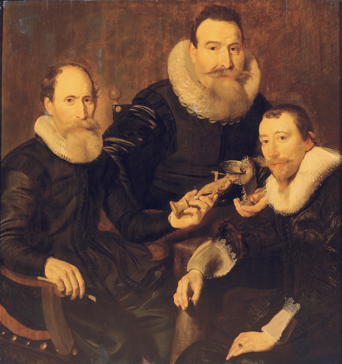 Gruppporträtt av tre herrar, trekvartslångt, sittande i svarta dräkter med spetskragar, 1635 av Thomas de Keyser