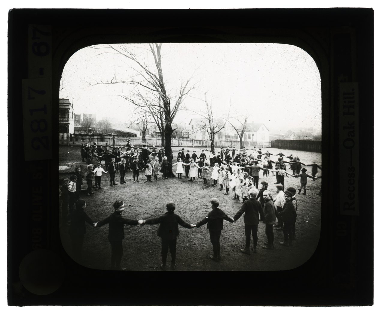 Horizontal, black and white photo of boys and girls holding hands and forming circles outdoors av Unbekannt Unbekannt