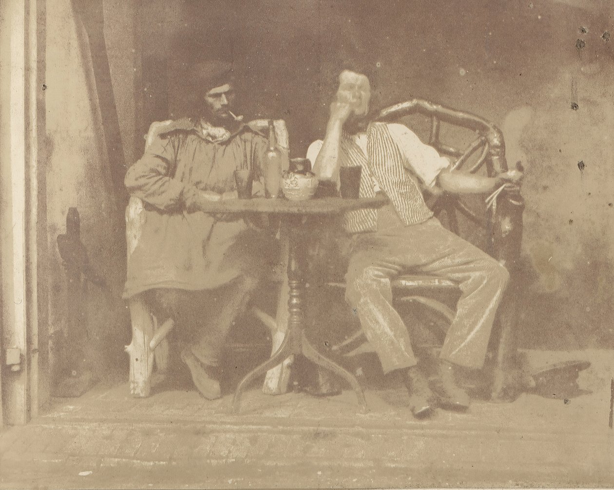 Två män vid ett bord, 1850-talet. av Unbekannt
