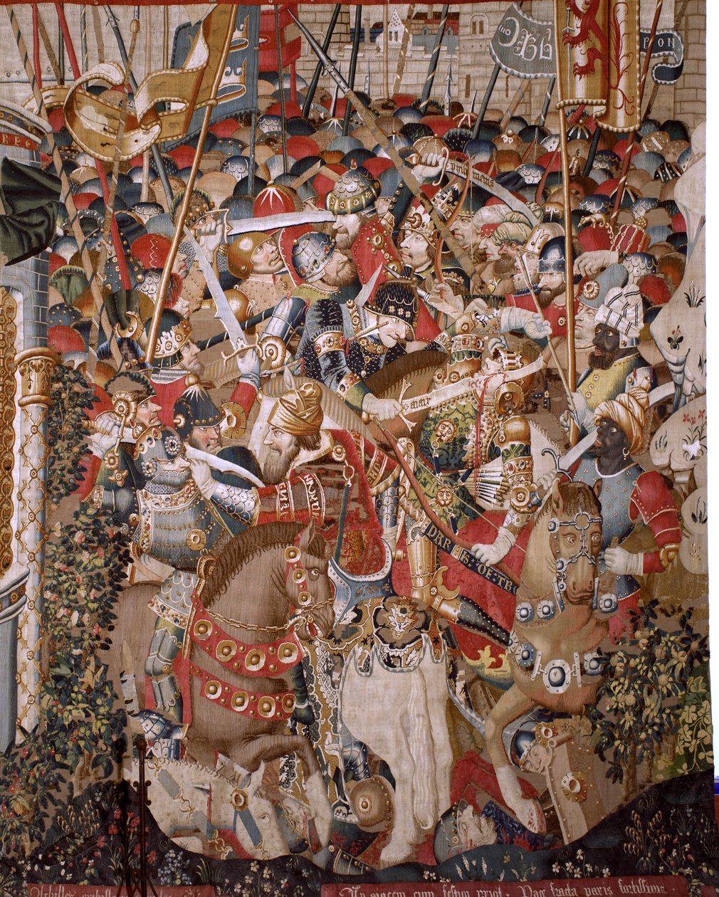 flamländsk gobeläng. Serien Det trojanska kriget. Akilles död (Muerte de Aquiles). Åttonde gobeläng i serien. Modell Coëtivy Master (Henry eller Conrard de Vulcop). Tillverkar Tournai-verkstäder. Ca 1470. Tyg Ull och siden, 6/7 varp per cm. Storlek 482 x 9 av Unbekannt