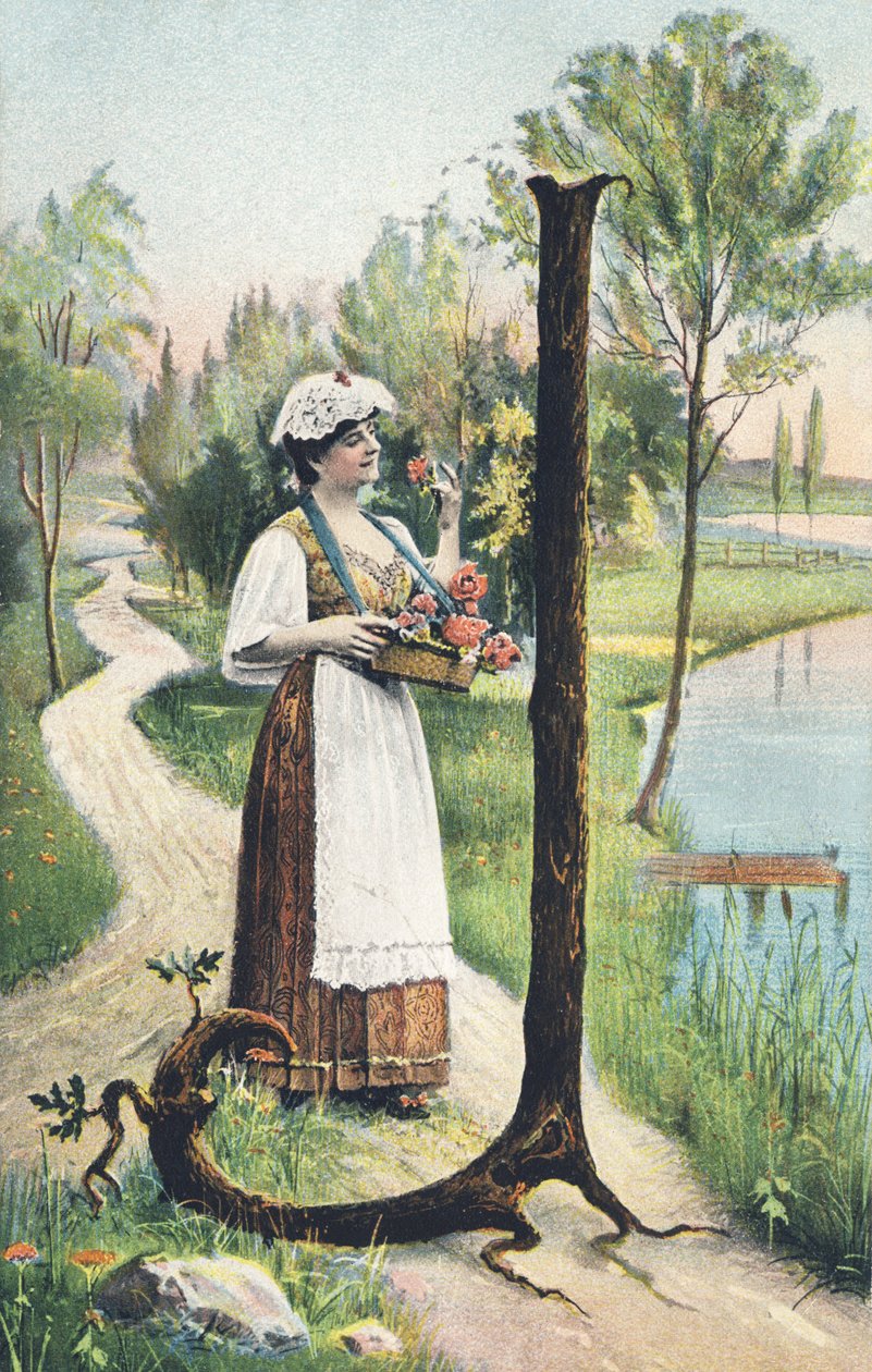 J: En stående kvinna i lång kjol, förkläde och livstycke bär en korg med blommor. Landsdekor - Alfabettecken Ref Th. E., L. Theochrom - Serie 994. Theodor Eisman, förläggare, Leipzig av Unbekannt