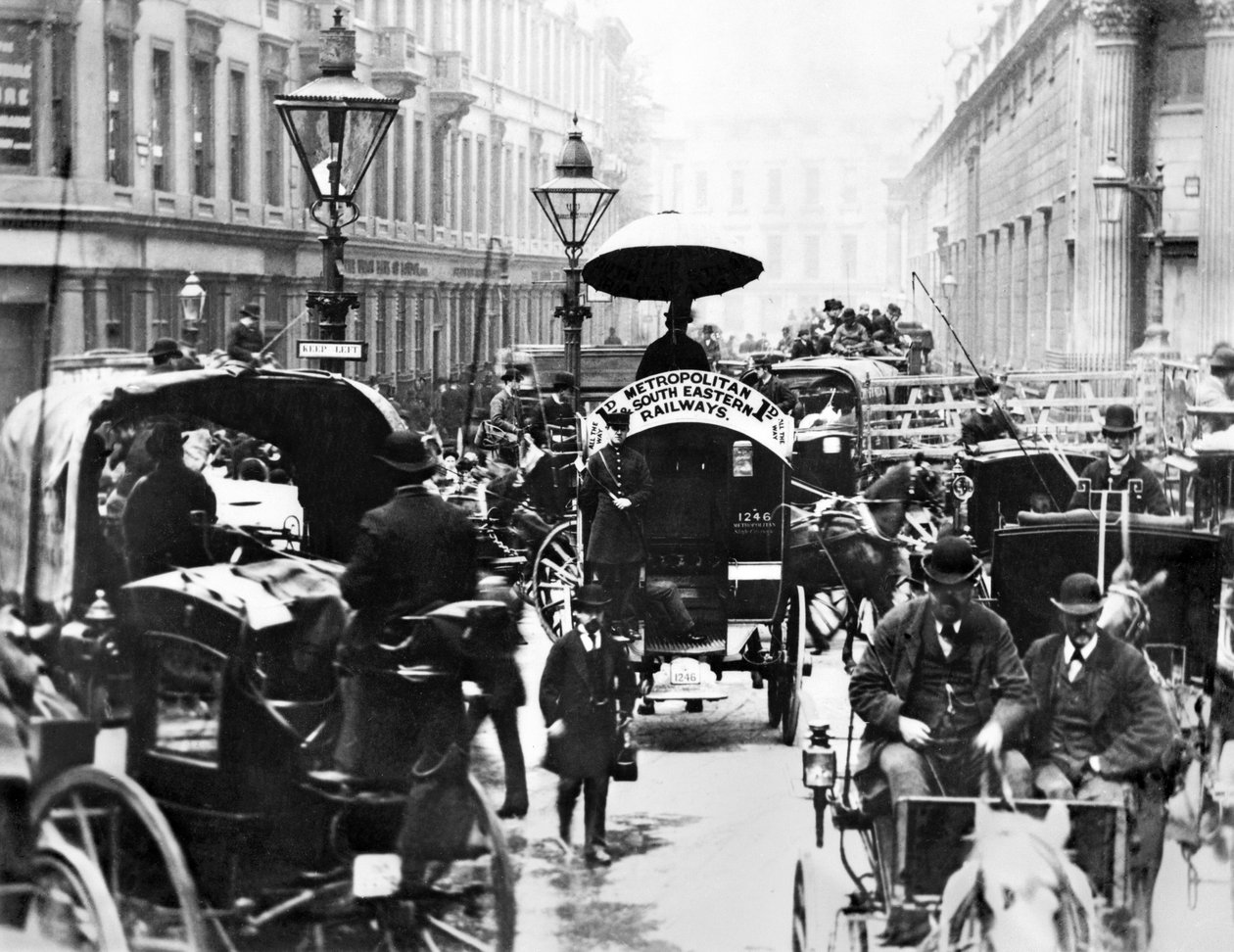 Storbritannien: En upptagen scen på banken som visar Metropolitan och South Eastern Railways Bus. London, c1878 av Unbekannt