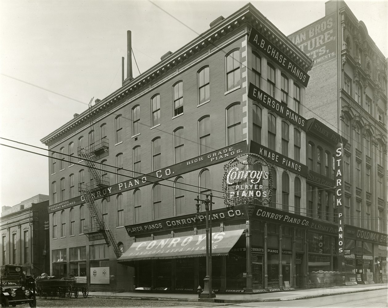 Conroy Piano Company, southeast corner of Eleventh and Olive Streets av Unknown