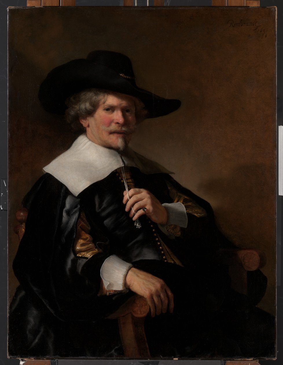 Porträtt av en man som sitter i en fåtölj av Unknown