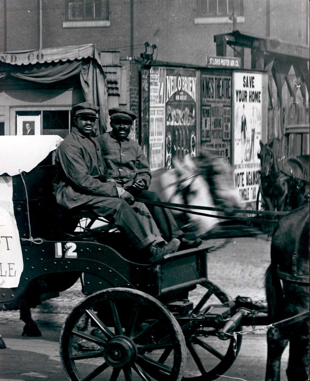 Teamsters drive a city ash wagon in a parade of sanitation equipment on Market Street av Unknown