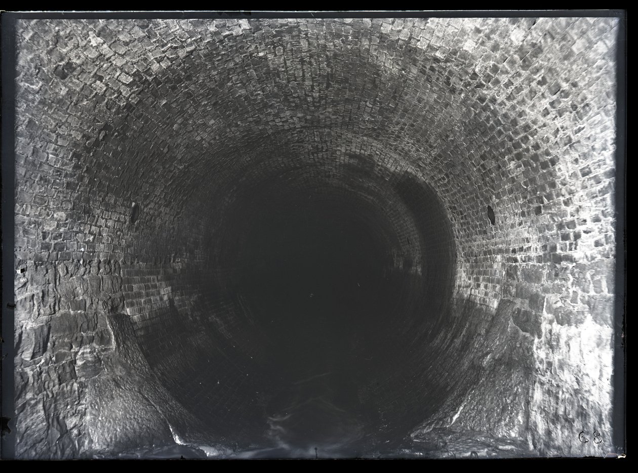 View looking down an unidentified brick sewer av Unknown