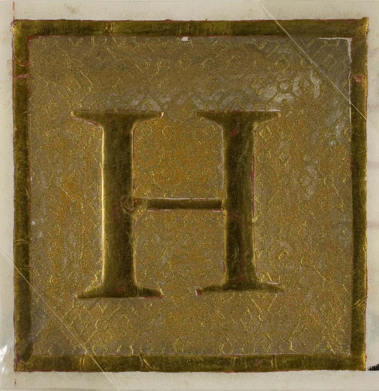 Illuminerat initialt "H" i blöjmönster från en körbok av Unknown artist