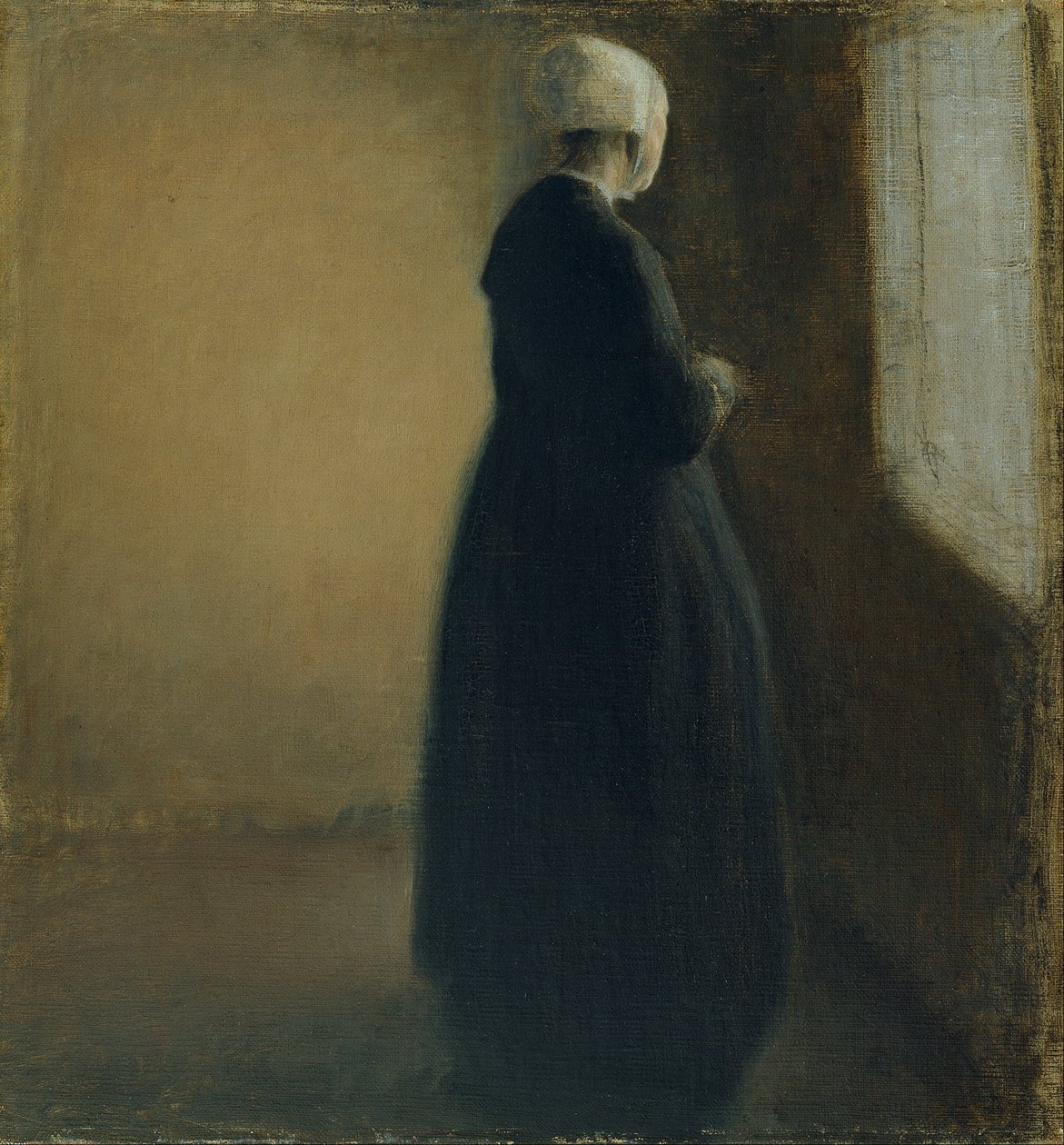 En gammal kvinna som står vid ett fönster av Vilhelm Hammershøi