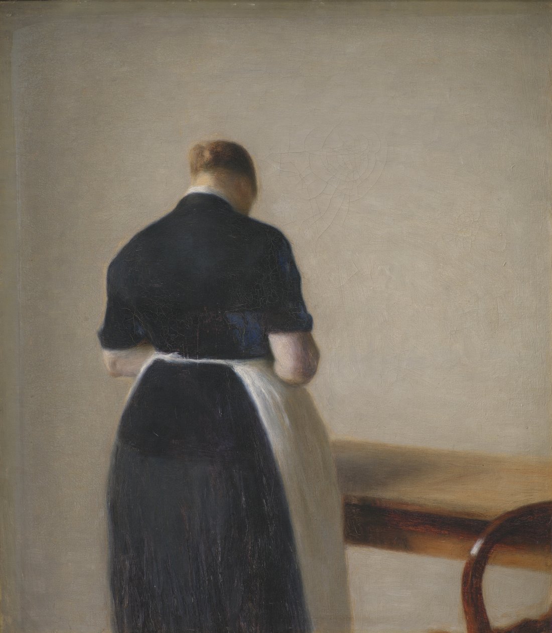 Kvinna sedd bakifrån av Vilhelm Hammershøi