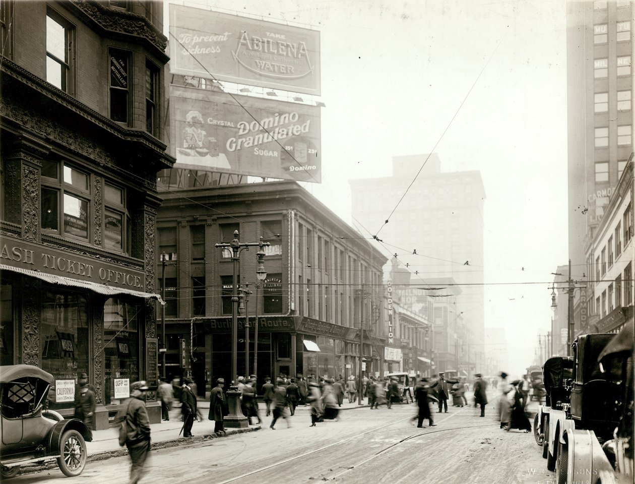 Pedestrian traffic at the intersection of Eighth and Olive Streets, looking south toward Olive Street av W.C. Persons