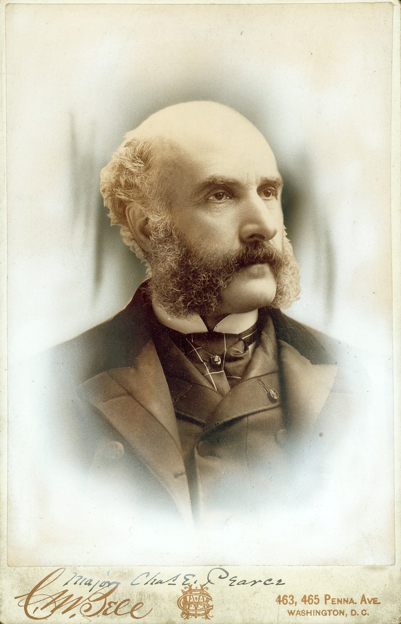 Bust portrait of Charles E. Pearce wearing a suit, vest, and tie av Washington D.C. C.M. Bell