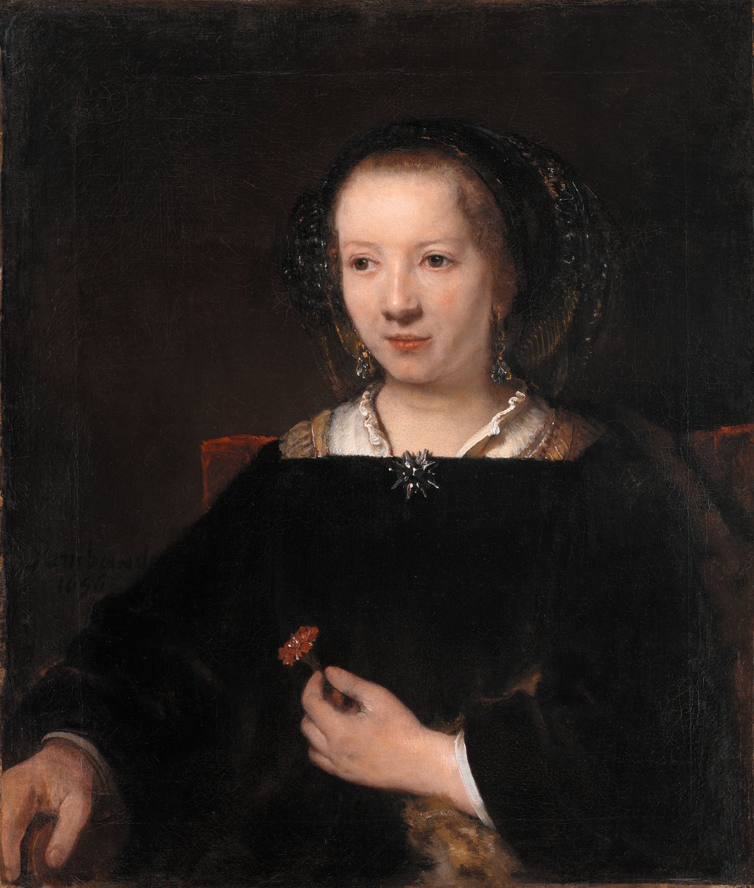 Ung kvinna med en nejlika av Willem Drost