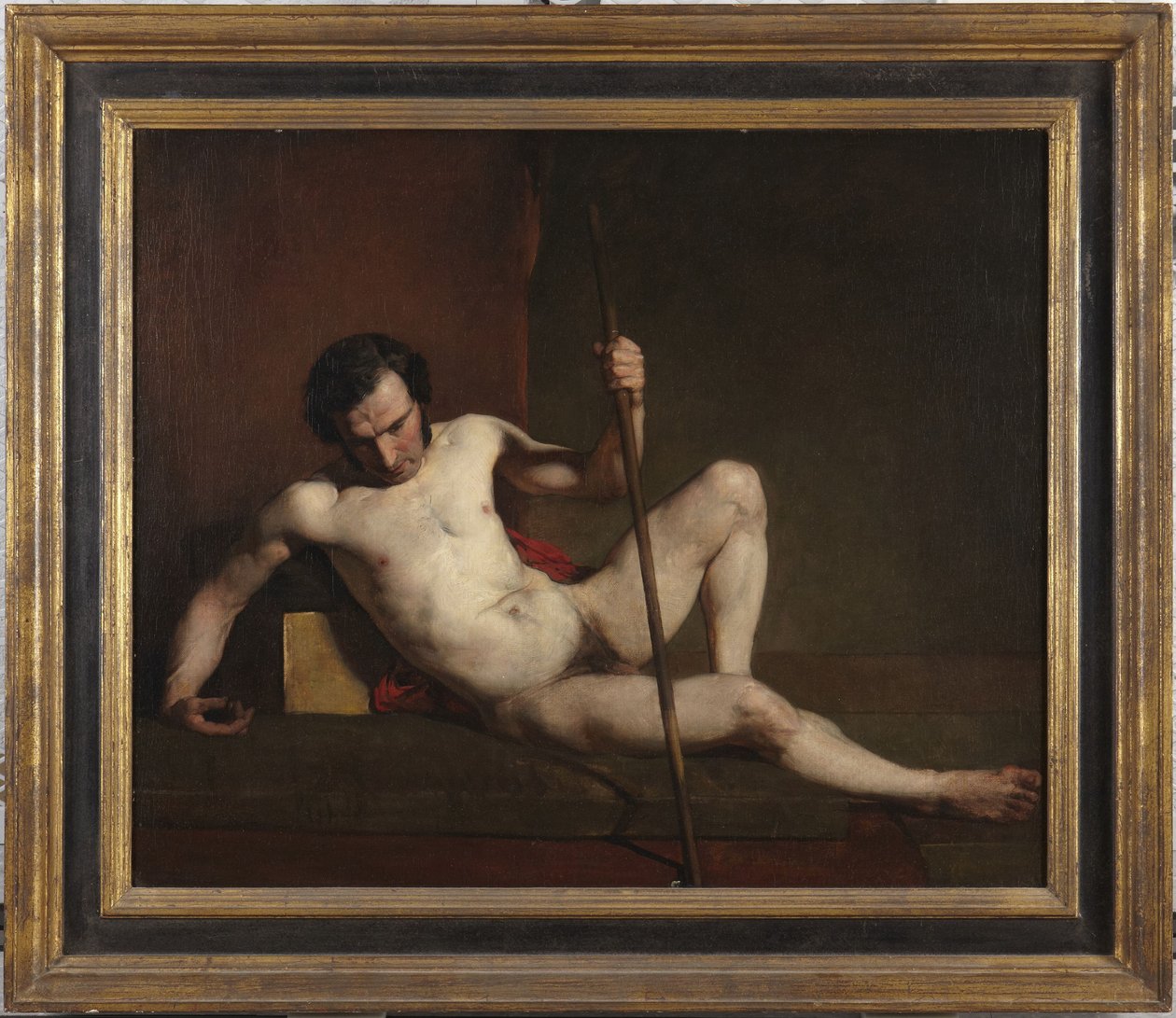 Manlig nakenmodell lutad mot en stav av William Etty