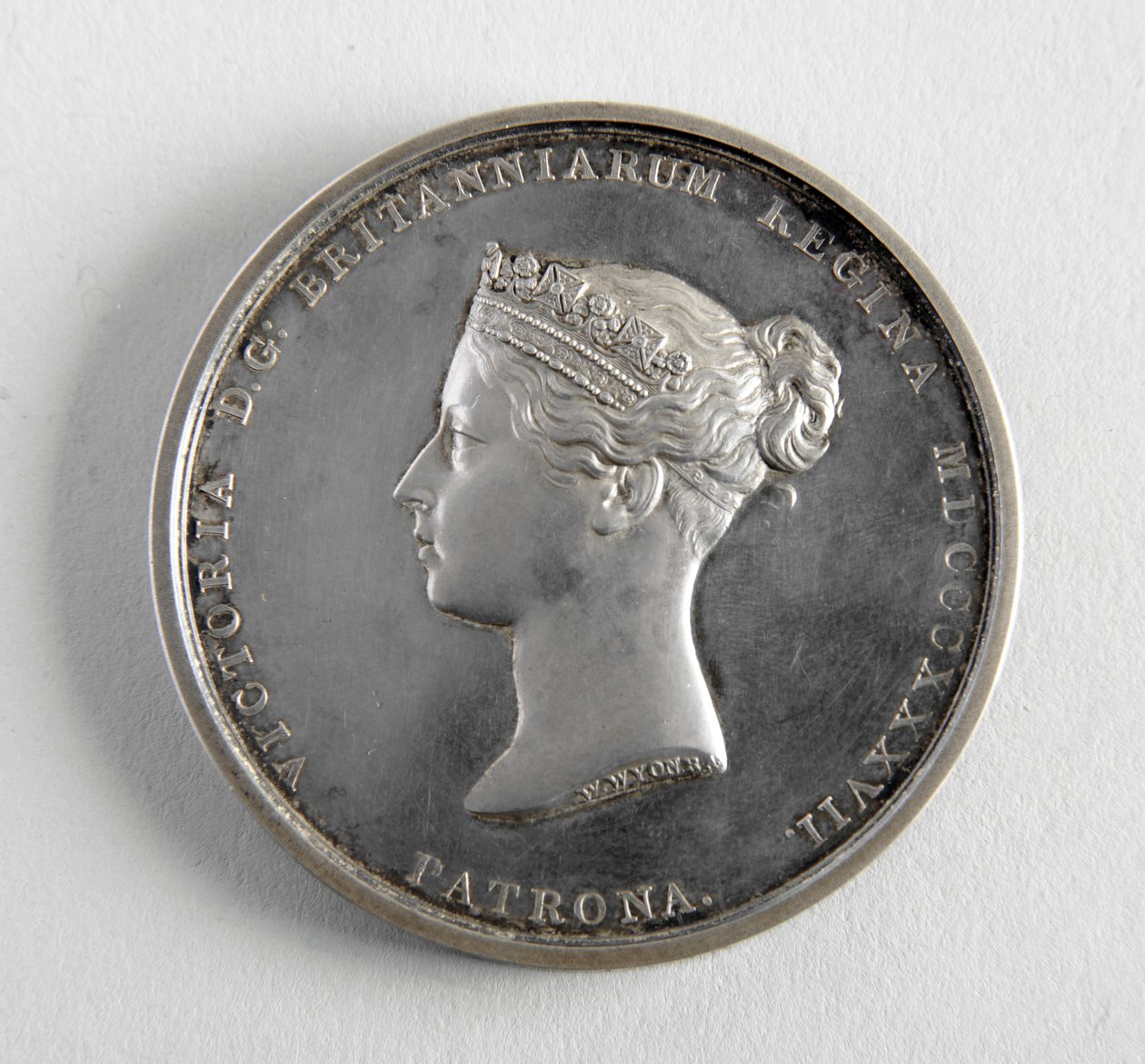 R.A. medalj tilldelas George Frampton 10.12.1884 för bästa modell av en figur (metall) av William Wyon