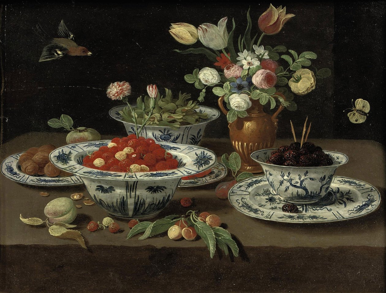 Smultron i en kinesisk "kraak"-skål av porslin, björnbär i en annan skål stående på en tallrik, olika blommor i en bronsvas, damsons i ytterligare en skål och valnötter på en tallrik, med en persika, en kvist körsbär och annan frukt, allt på en sten av Workshop of Jan van Kessel the Elder