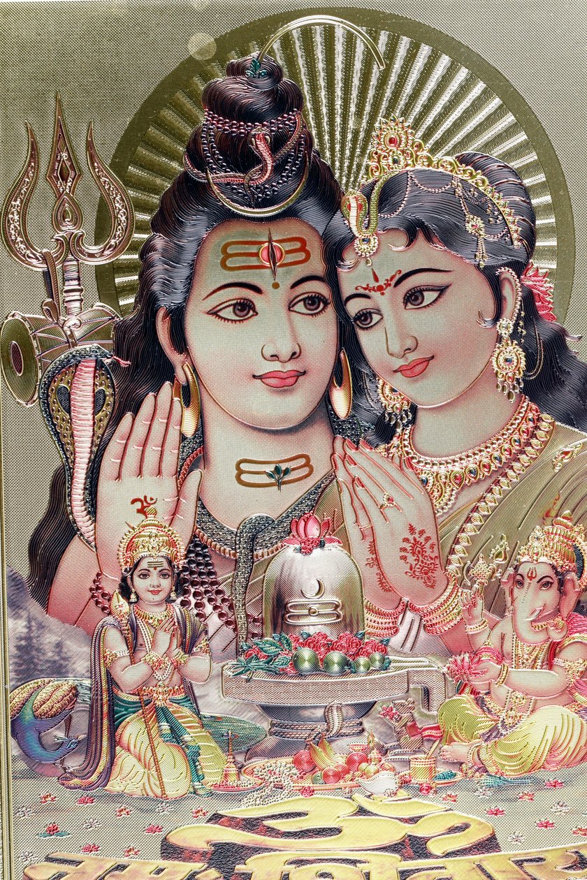 Gud Shiva och gudinnan Parvati med sin son Ganesha. av . .