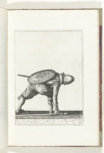 Sköld- och spikövningen: Soldaten böjer sig ner för att plocka upp spiken (nr 28), 1618 Nassausche Wapen-Handelinge, van Schilt, Spies, Rappier and the Targe: beyde figuerlick avbildad, och den inramade efter den nya ordningen [av] (...) Maurits van Nassau av Adam van Breen
