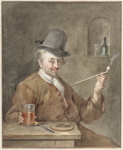 Rörrökande man vid ett bord med en tallrik, en kniv och ett glas