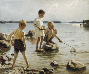 Pojkar som leker på stranden