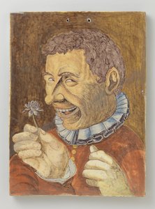 tallrik av fajans med man med blomma av Anonymous