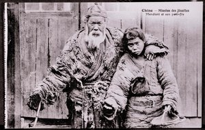 Gammal tiggare med barnbarn Fotografi från början av 1900-talet - Privat samling av Anonymous Anonymous
