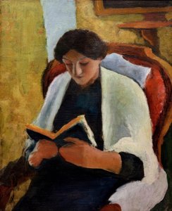 Läsande kvinna i den röda fåtöljen av August Macke