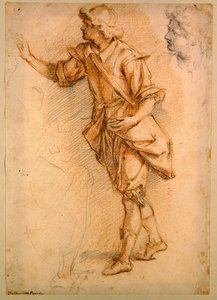En stående figur (svart och röd krita på papper)