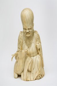 Snidade elfenbensfigur av Shou Xing sittande med rådjur, ca 1580-1644 av Chinese School