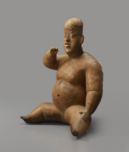 Sittande figur (lergods med slip)