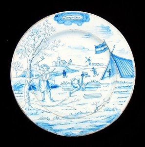 Delftware-tallrik föreställande december månad (tennglaserat lergods) av Dutch School